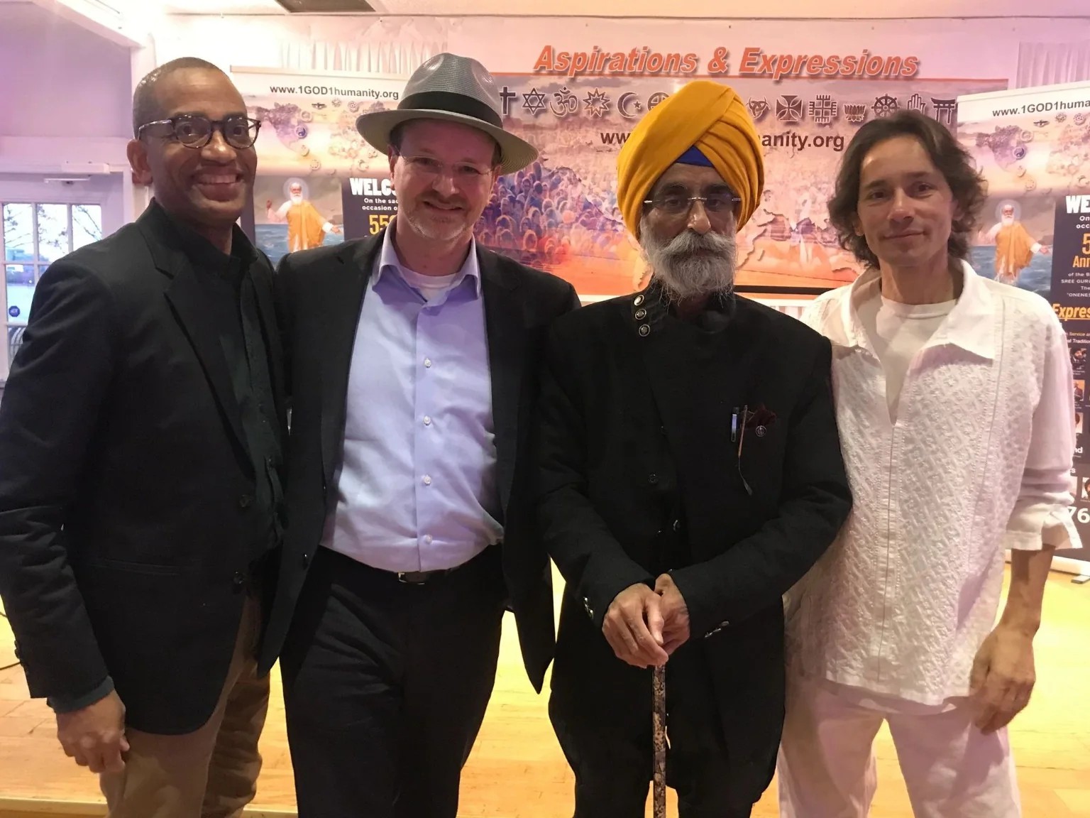 Jason Caplan with interfaith collaborators at a public gathering.